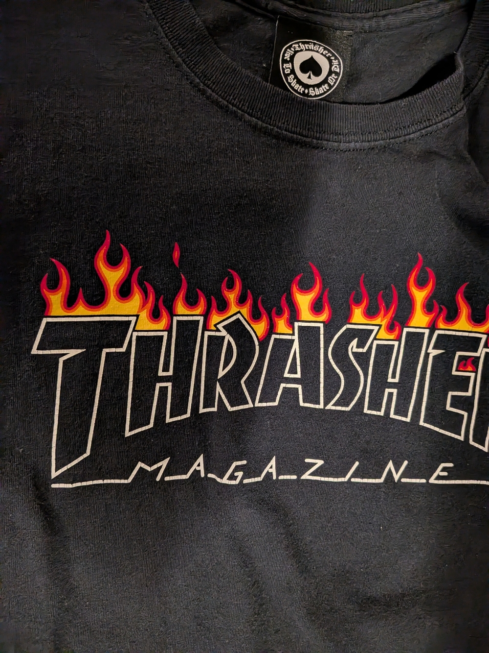 Zumiez Black Graphic Tee with Red and Yellow Flame Logo
